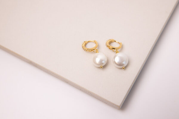 Enhance any look with the unique style of these Hoops Gold Filled 18K with Micro Zirconias and Natural Pearl earrings.