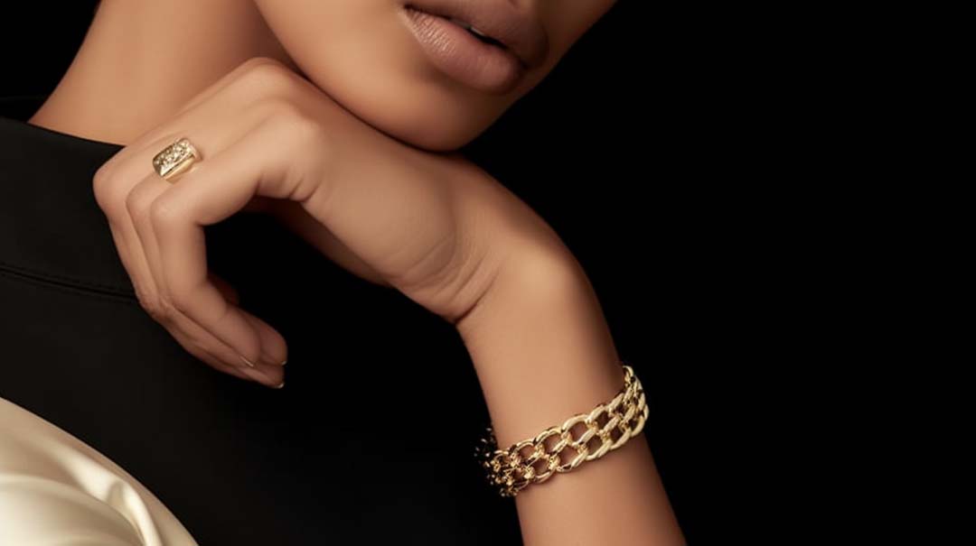 Woman wearing a Cuban link bracelet paired with other accessories