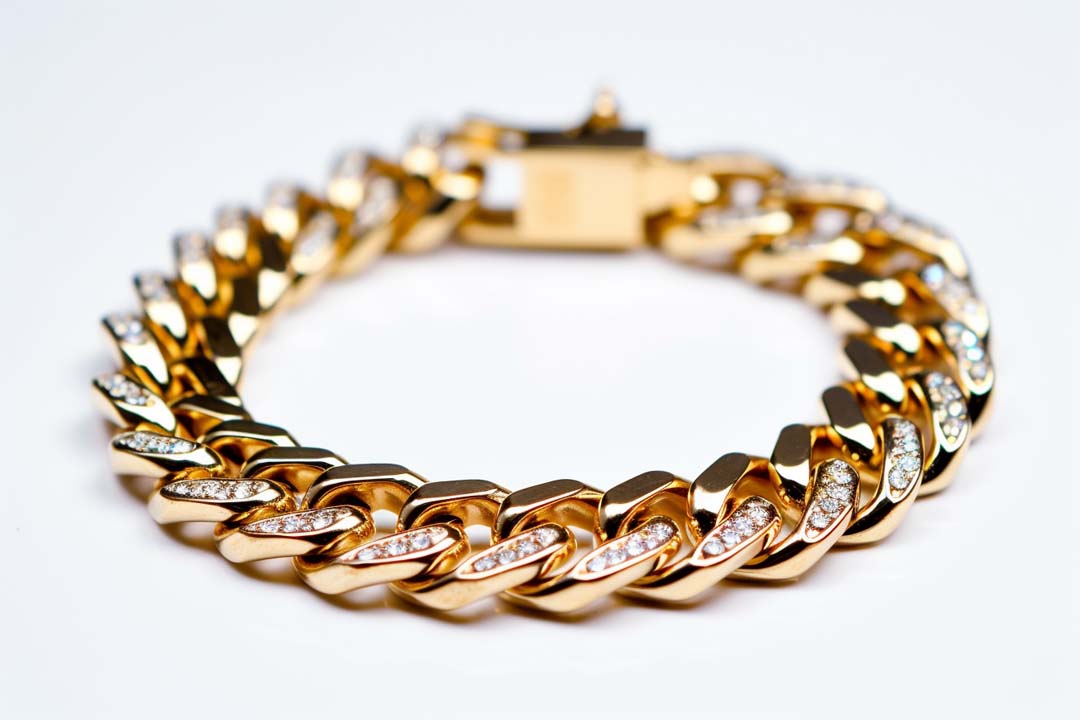 Close-up of the interlocking links in a Cuban link bracelet